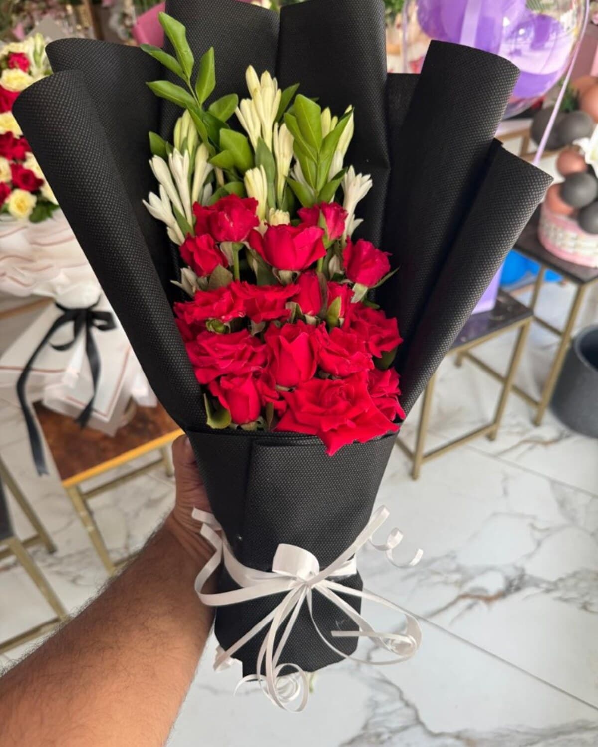 Red Rose Tuberose Black Wrap fresh flower bouquet by Phool Pattiyan Lahore