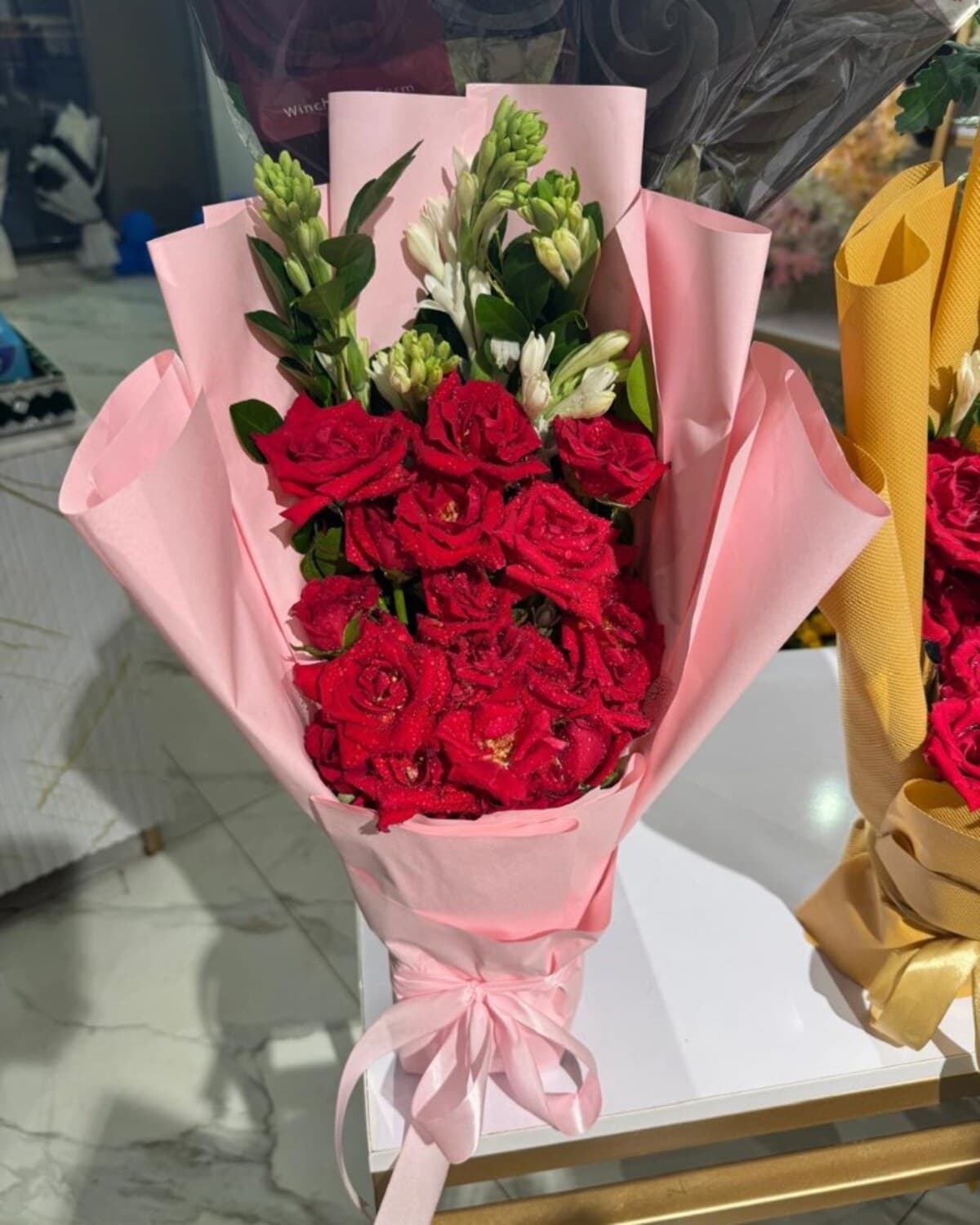 Red Rose Tuberose Pink Black Wrap fresh flower bouquet by Phool Pattiyan Lahore