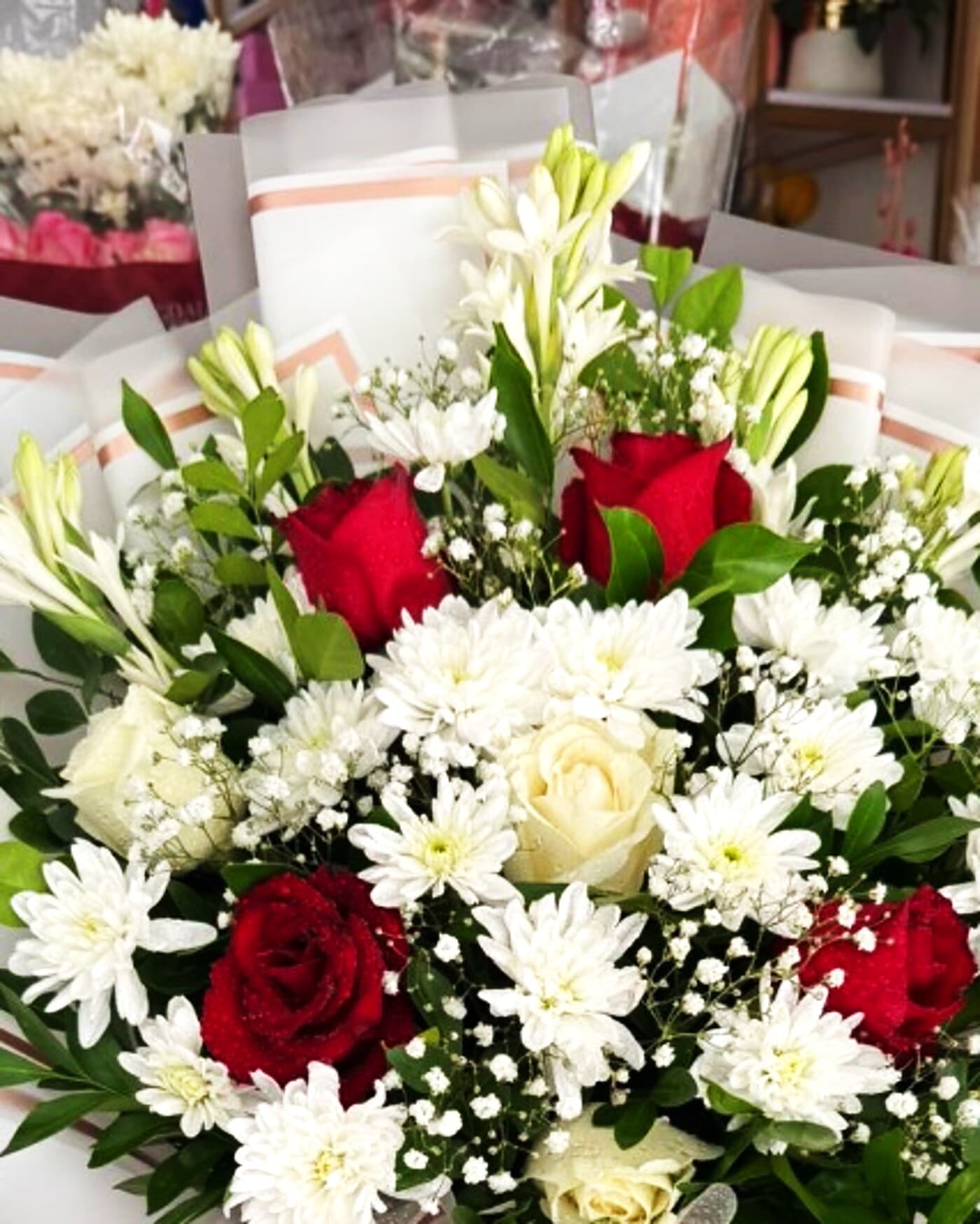 Premium crimson and ivory tuberose bouquet by Phool Pattiyan Lahore